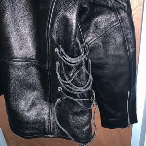 Milwaukee Black Leather Motorcycle with purple/black leather gloves